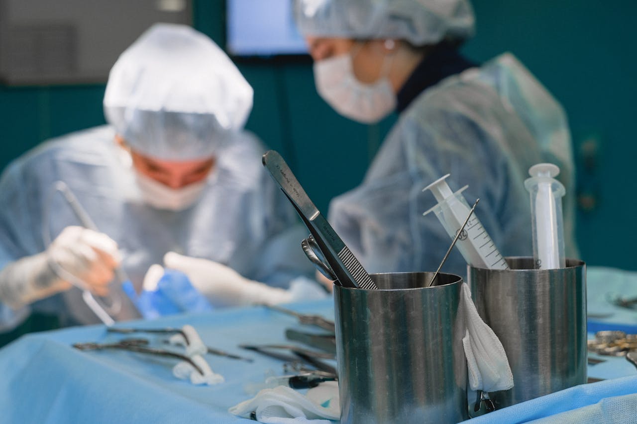 Medical Instruments and a Surgeon During a Surgery